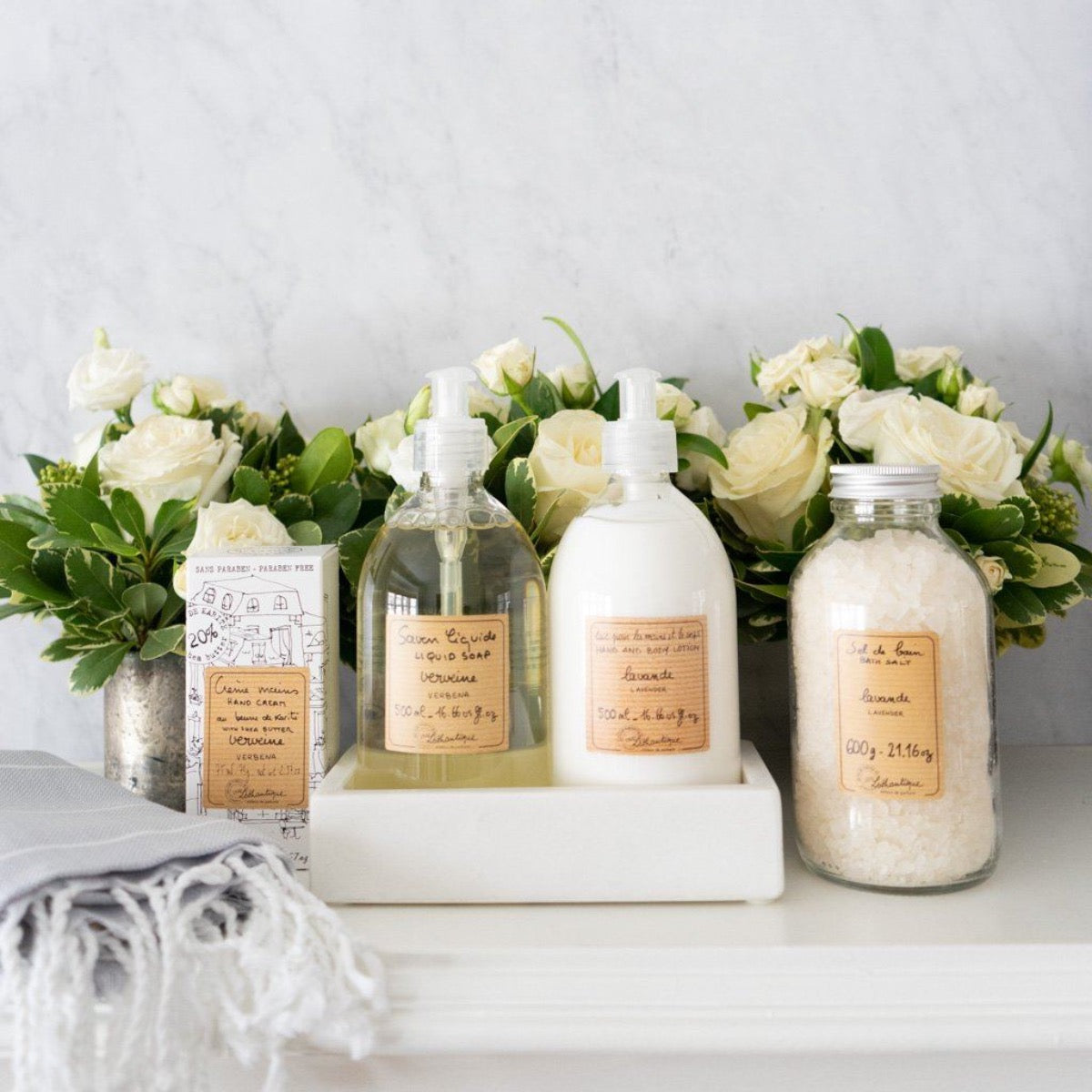 Rectangle Marble Tray - Small styled with soap, lotions and florals. Styled view.