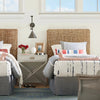 Riviera Twin Headboard styled in a bedrooms beside night stand and metal wall sconce. Styled view.