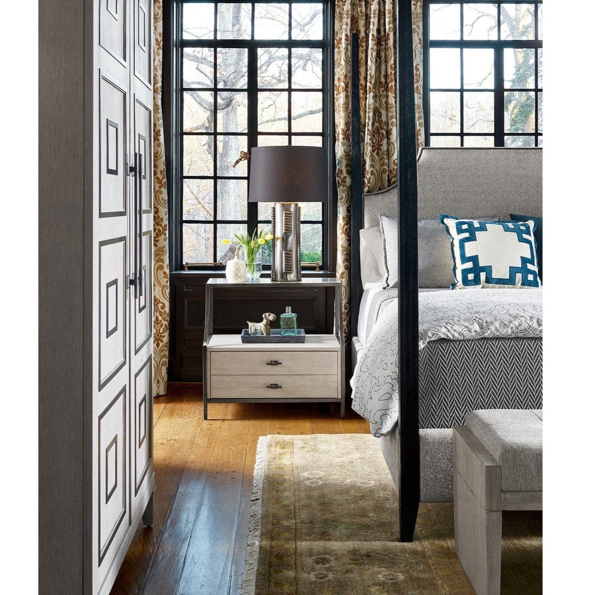 Sam Nightstand styled with grey bedding, greenery and glassware. Styled view.
