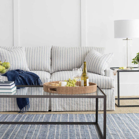 Samson Navy Indoor/Outdoor Rug styled in a grey living room. Styled view. 