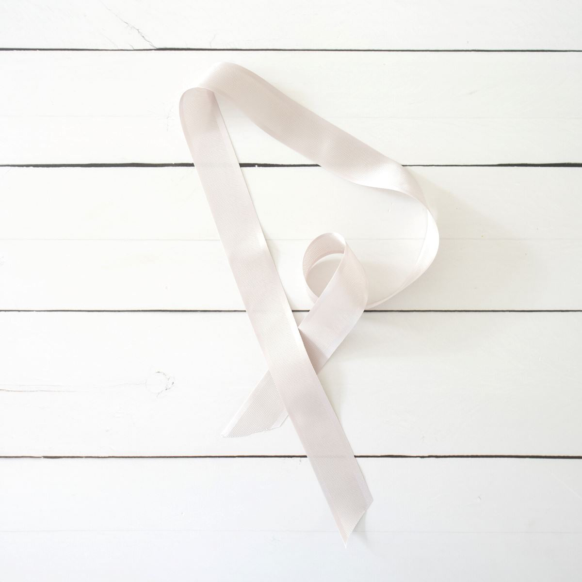 Satin Grosgrain Ribbon - Oyster on white back. Styled view.