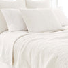 Seychelles Dove White Quilt styled with white sheets. Styled view. 