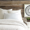 Seychelles Dove White Quilt styled with white sheets. Styled view. 