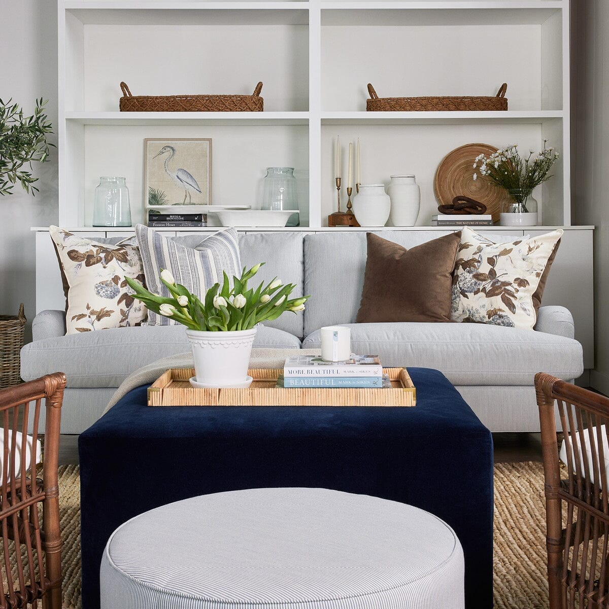 Stephen Sofa styled with blue and brown pillows in a fall living room. Styled view.