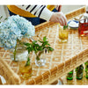 Tanner Rattan Bar Cart styled with glasses and blue florals. Styled view.