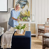 Thomas Block Ottoman styled with accents chairs, console table and decor. Styled view. 